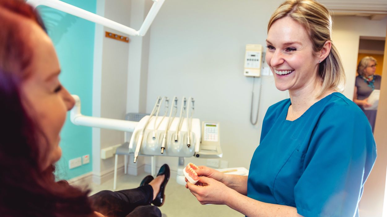 Dentist showing denture options at Kingswood Parks Dental Clinic Dental Hull